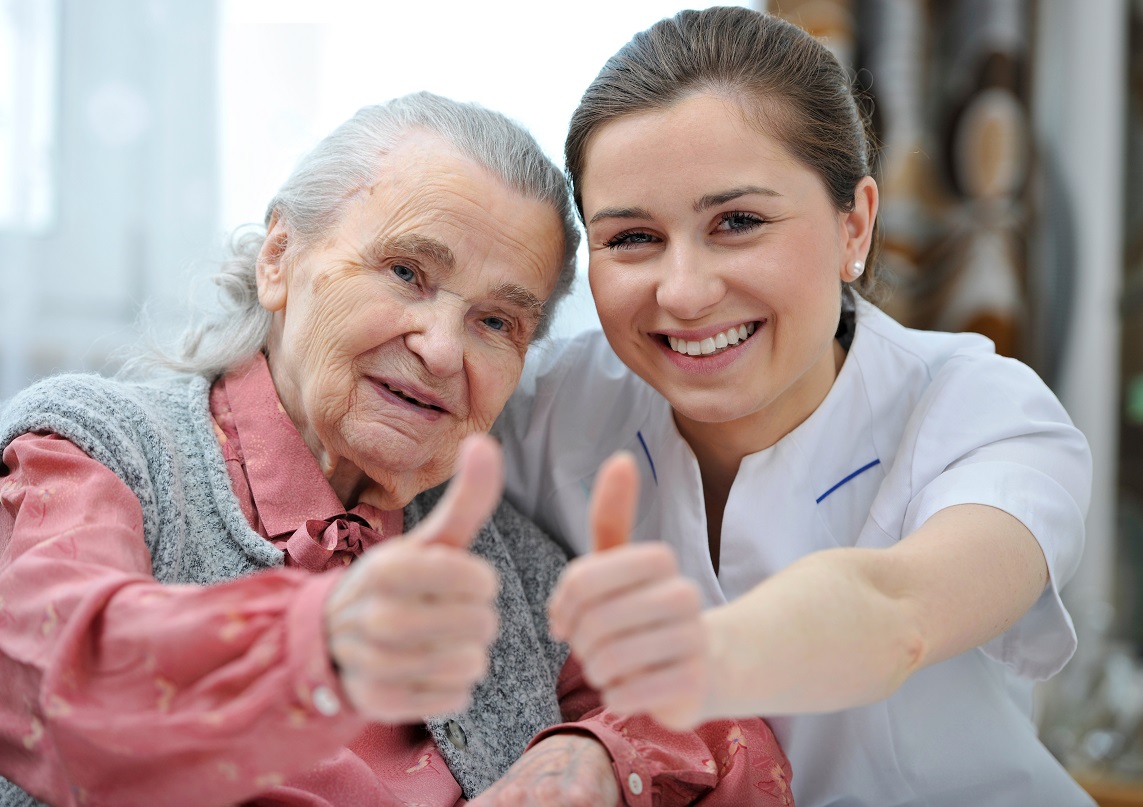 Social worker helping a senior with paperwork